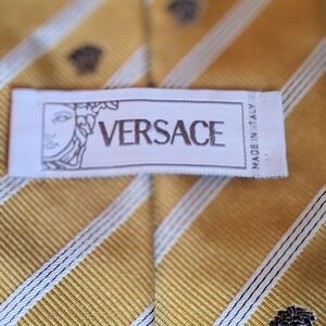 Versace Gold Striped Tie With Black Versace Logo.